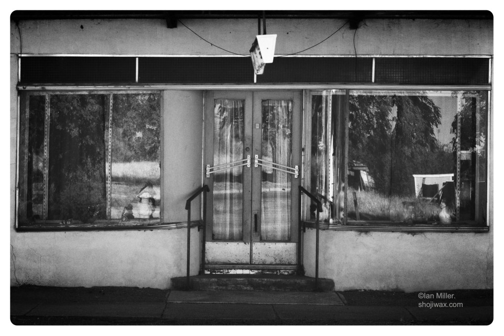 Monochrome photo of old country store long since closed.